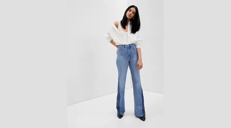 High rise patched ‘70s flare jeans with washwell